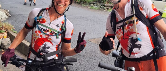 Couple on bikes pose for picture in Japan.