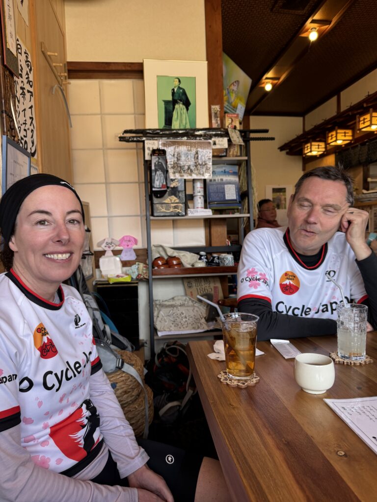 Two cyclists enjoy a lunch break in Unagi (Eel) restaurant.