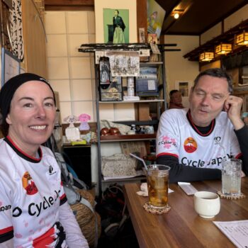 Two cyclists enjoy a lunch break in Unagi restaurant.