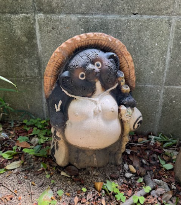 Tanuki a Japanese racoon dog mythical creature from folklore that brings good luck in Japanese culture.